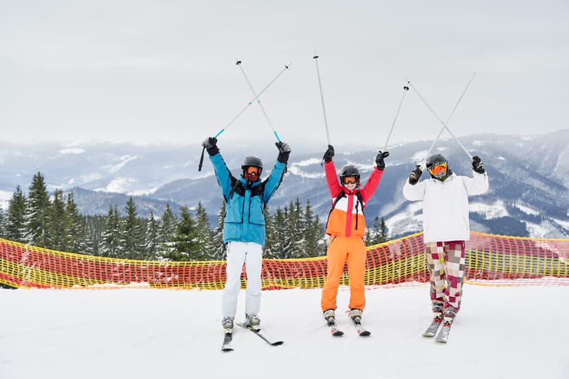 friends-skiers-having-fun-ski-resort-mountains-winter-skiing-snowboarding